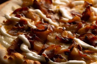 Caramelized Onion and Bacon Pizza with White Sauce and Mozzarella Cheese