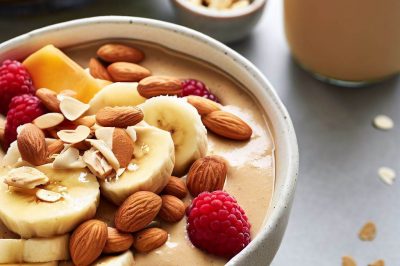 Peanut Butter and Banana Smoothie Bowl with Fresh Fruit and Almond Milk